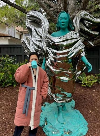 Priscilla Chan beside the statue