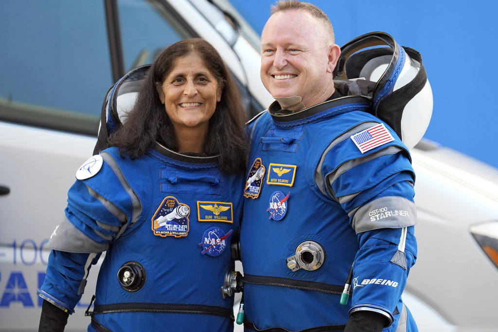 Astronauts onboard the Crew Dragon capsule