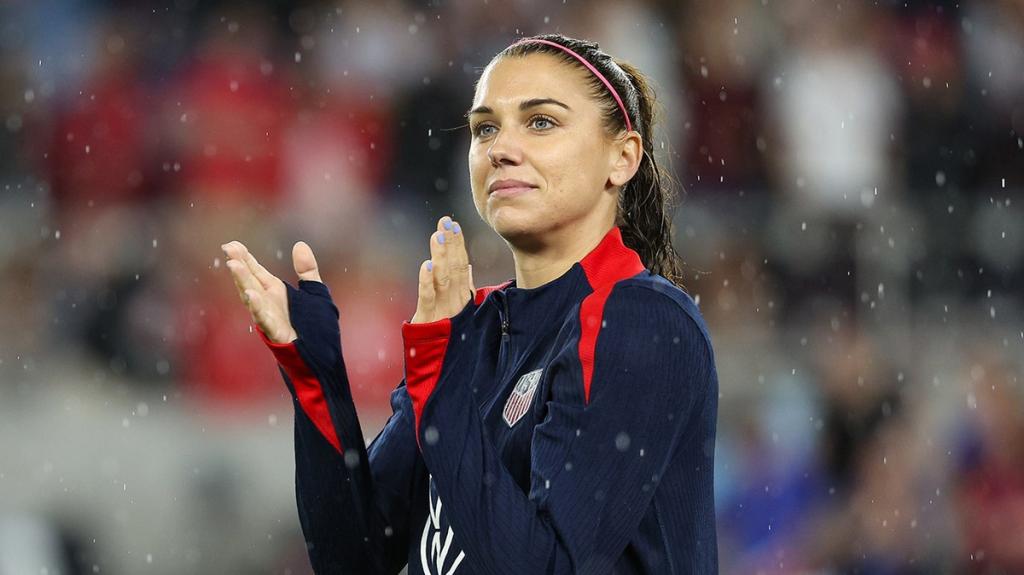 Alex Morgan celebrating after scoring a goal